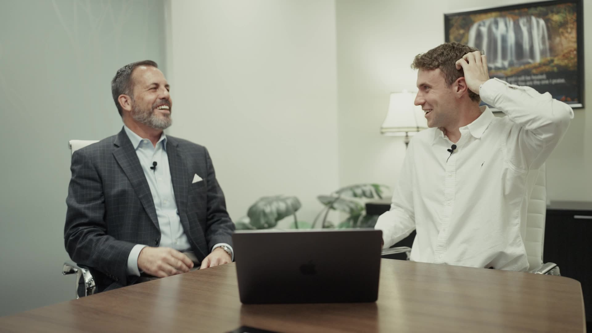 A Tennr customer laughing during the voice calling product demo